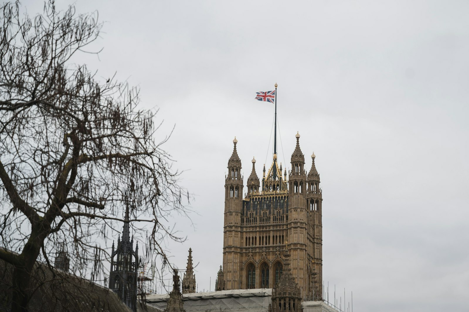 a tall tower with a flag on top of it